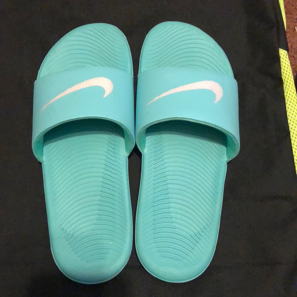 Teal and White Nike slides